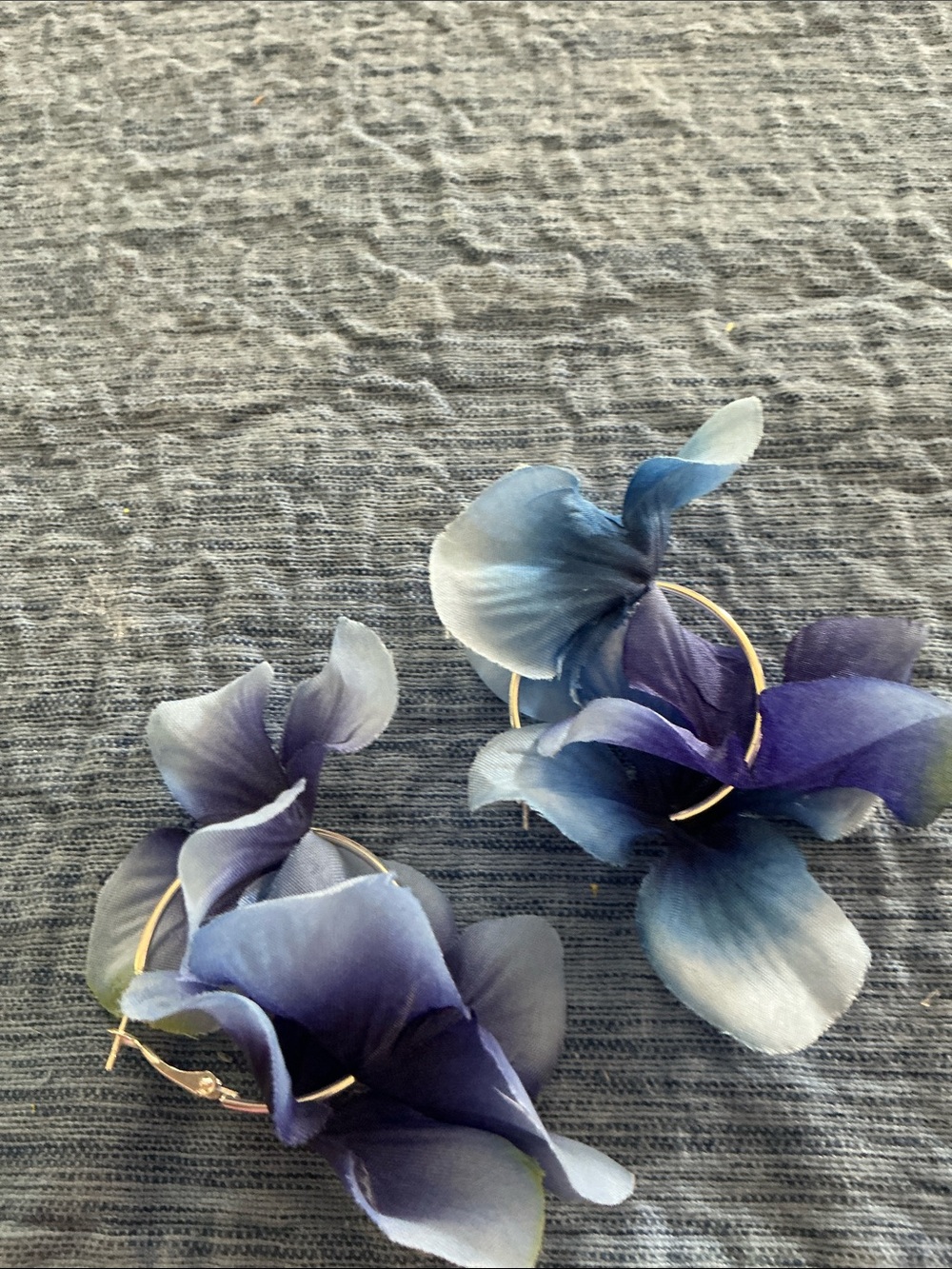 Handmade blue flowered pierced earrings on silver toned hoops